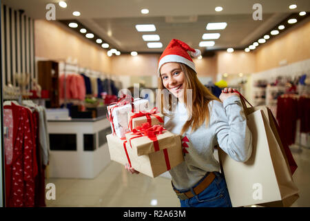 gift boxes wearing christmas hat 