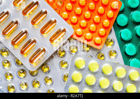 Pills blisters of colorful pharmacy to cure pain and illness. Could be used by sick people with medicine addiction Stock Photo