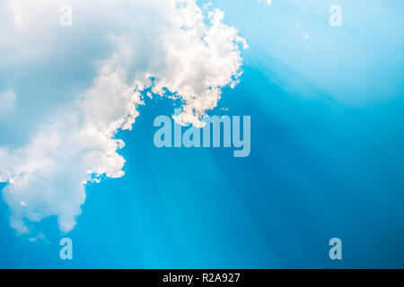 Blur sky and rays of light shining down with clouds atmospheric effect. Stock Photo