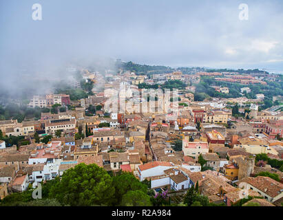 Medieval downtown of Begur in the fog. View from the Castle of Begur. Girona, Costa Brava, Catalonia, Spain. Stock Photo