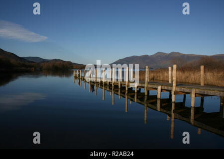 Skiddaw over Derwent Water with jetty reflections Stock Photo