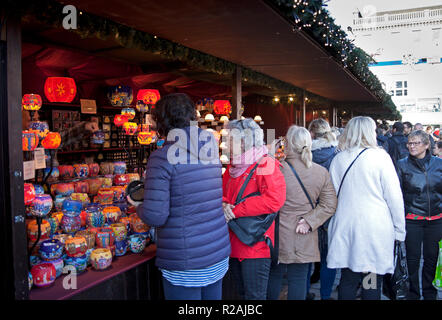 Edinburgh, Scotland. UK 18 Nov. 2018. the sunshine got people out to visit the Princes Street Market on this first Sunday. The gift stalls were fairly busy with people buying and the food stalls were doing a roaring trade with the various and unusual treats that they had on offer. Stock Photo