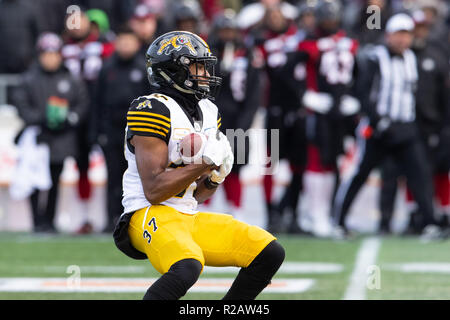 Montreal Alouettes wide receiver Reggie White Jr (84) carries the ball past  Hamilton Tiger-Cats defensive back Cariel Brooks (26) during first half  exhibition CFL football action in Hamilton on Saturday, May 28