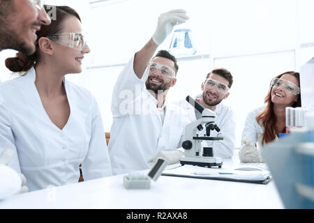 group of young workers are working in biochemistry lab, Stock Photo