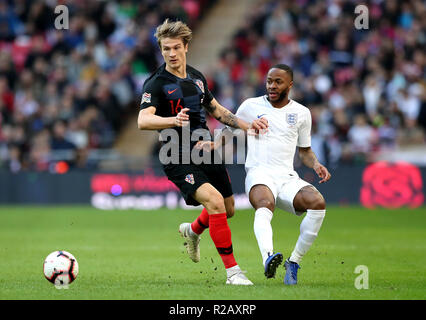 Croatia's Tin Jedvaj (left) and England's Raheem Sterling (right) during the UEFA Nations League, Group A4 match at Wembley Stadium, London. Stock Photo