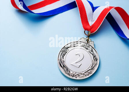 Medal on a red, white and blue ribbon Stock Photo - Alamy