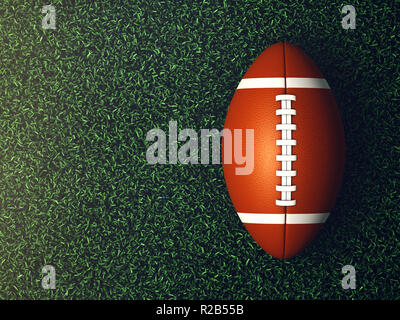 American football ball on grass lit by spotlight seen from the top, Sport arena Stock Photo