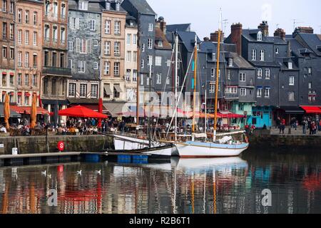 HONFLEUR, FRANCE - APRIL 8, 2018: view of the bay and the embankment  in the famous French city Honfleur. Normandy, France Stock Photo