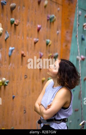 Bouldering, beautiful girl look on the climbing wall. Assessment of their  capabilities Stock Photo - Alamy