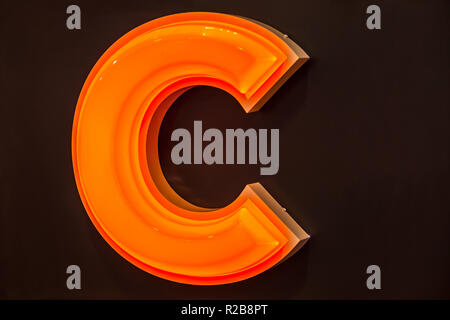 The letter C as a sign object over dark background. Stock Photo
