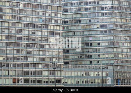 The windows of large multi-occupation tower blocks UK Stock Photo