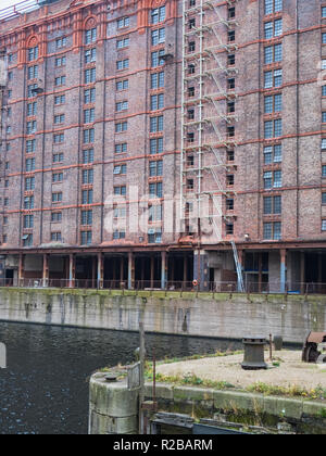 Derelict Victorian tobacco warehouse and disused pier at the redundant  Stanley Dock on the Liverpool waterfront Stock Photo
