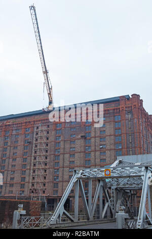 Derelict Victorian tobacco warehouse on the main dock road through the Liverpool waterfront Stock Photo
