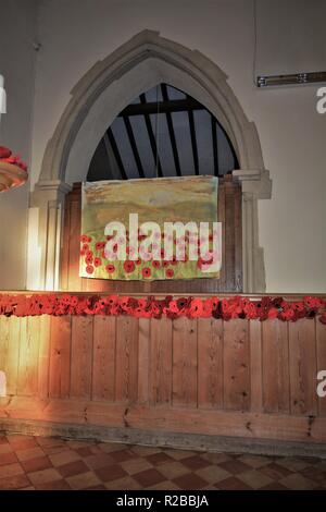 Barnham Suffolk country village in November on 100 anniversary of the end of first world war church decorated with hand made poppies Stock Photo