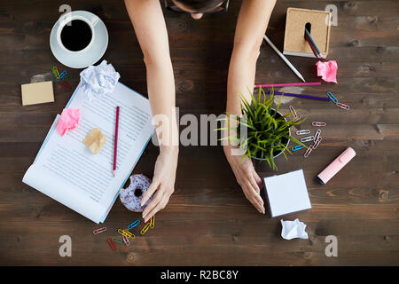 Woman Tidying Up Office Desk Stock Photo