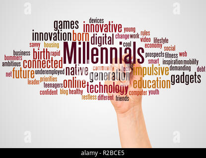 Millennials word cloud and hand with marker concept on white background. Stock Photo