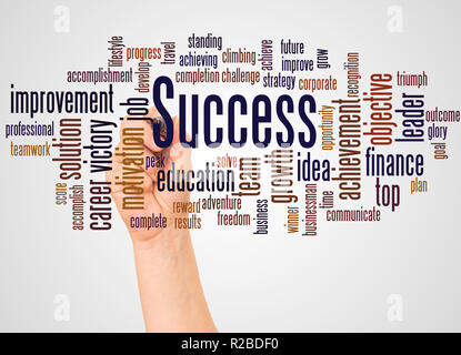 Success word cloud and hand with marker concept on white background. Stock Photo