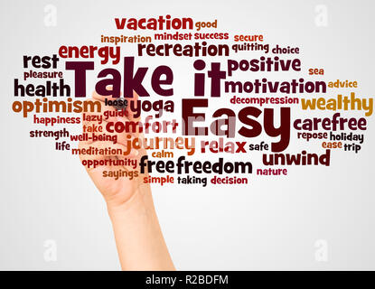 Take it Easy, word cloud and hand with marker concept on white background. Stock Photo