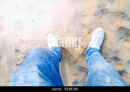 top view of a stylishly dressed guy in the sand dune Stock Photo