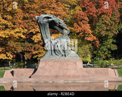 Chopin at baths park and colorful trees in european city of Warsaw, Poland in 2018 warm sunny autumn day on October. Stock Photo