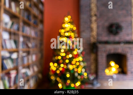 Christmas background. Christmas tree with lights at orange background Stock Photo