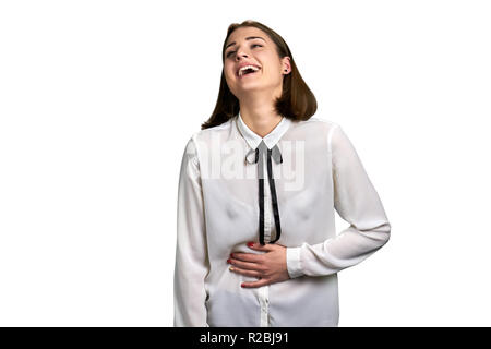 Cheerful woman laughing on white background. Studio shot of young pretty business woman is laughing heartily. Stock Photo