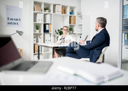 Business executives discussing project plan Stock Photo