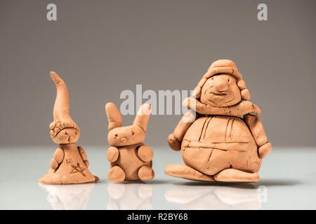 Small figurines made of clay by a child Stock Photo