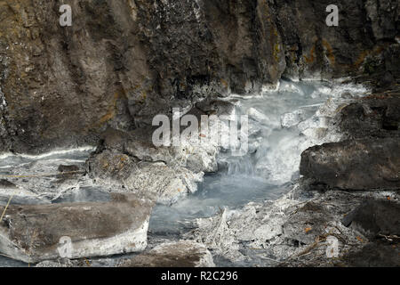 A close up image of a sulpher spring and the opening in the mountain where it first comes out of the mountain in Jasper National Park Alberta Canada. Stock Photo