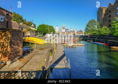 Shadwell, East London, uk - May 7, 2018: view of the outdoor activity centre at Shadwell basin and looking towards the backdrop of Canary Wharf buildi