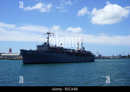 US Naval vessel, USS Emory S Land, entering Pearl Harbor Naval Base Stock Photo