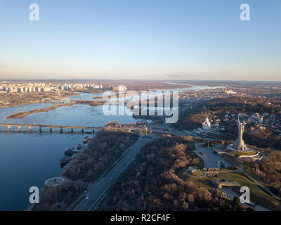 Beautiful urban landscape on the left, right banks of the Dnieper, Kiev, Ukraine, modern architecture against the blue sky on a sunny spring day Stock Photo