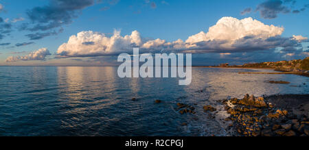 Wide panorama of beautiful clouds over ocean coastline in Frankston, Victoria, Australia Stock Photo