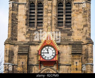 Unusual ornate wooden clock face on spire of St Nicholas cathedral, Newcastle Upon Tyne, England, UK Stock Photo