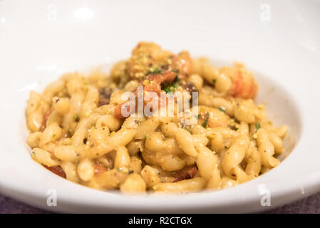 Busiate with pistachio pesto and shrimps served in a restaurant in Sicily, Italy Stock Photo