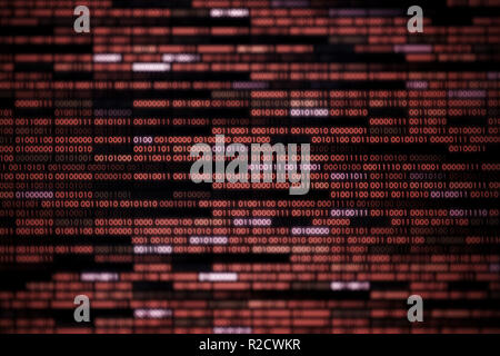 Computer display screen with red binary code moving in the background. blur defocus blue bokeh light. technology graphic design background concepts Stock Photo
