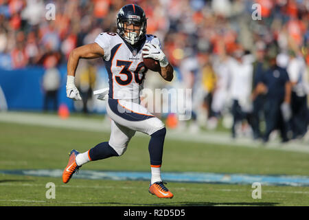 Denver, Colorado, USA. 1st Dec, 2019. Broncos RB PHILLIP LINDSAY starts to  take off his jersey to exchange with a Chargers player during the end of  the game at Empower Field At