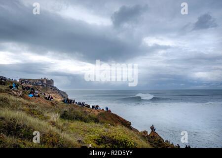 Nazare, Portugal. 18th Nov, 2018. Surfers tow in to giant waves at Portugal’s premier big wave spot Nazarè as a huge swells hit European coast line over the weekend Credit: Andy Bush/Alamy Live News Stock Photo