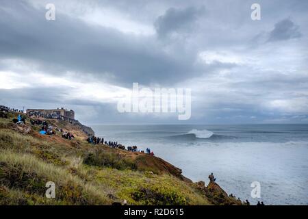 Nazare, Portugal. 18th Nov, 2018. Surfers tow in to giant waves at Portugal’s premier big wave spot Nazarè as a huge swells hit European coast line over the weekend Credit: Andy Bush/Alamy Live News Stock Photo