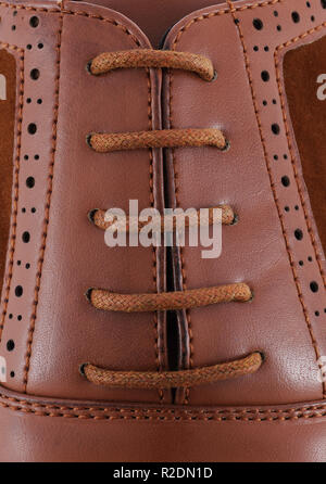 Brown leather men's shoewith brown laces close-up Stock Photo