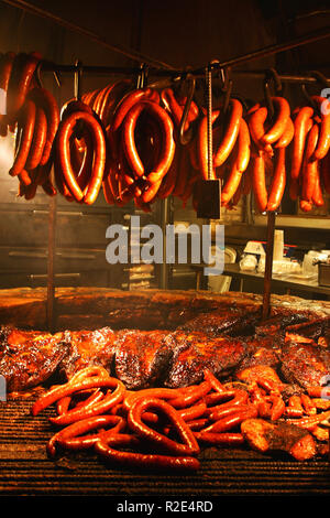 Sausages grilling over the fire pit at The Salt Lick, Driftwood (near Austin), Texas Stock Photo