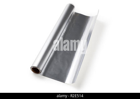 Aluminum foil roll on the white background, close up. Stock Photo