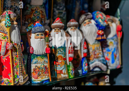 Colorful Christmas ornaments of Russian Santa Claus or Ded Moroz (Grandfather Frost) on display for sale in a souvenir shop in Saint Petersburg Russia Stock Photo