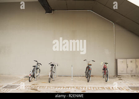 Bicycle in a Row Stand on a Parking. Eco friendly transportation concept. Stock Photo