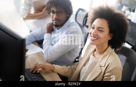 Programmer working in a software developing company office Stock Photo