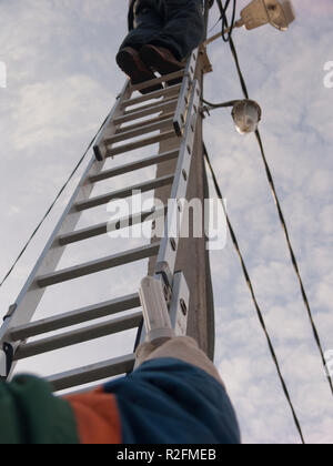 Electricians replacing lamps Stock Photo
