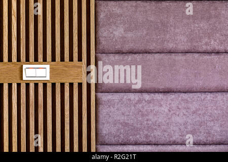 Brown wooden wall with purple fabric surface, background. Wooden texture, surface.  Home interior decor.  Texture, pattern. Stock Photo