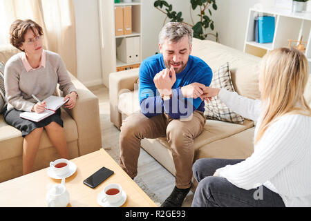 Wife hurting husband Stock Photo