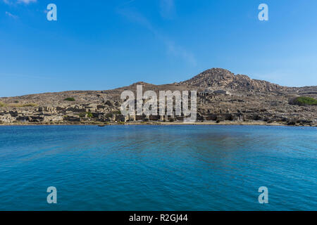 The ancient monuments and ruins on the sacred island of Delos, Greece. The birth place of god Apollo. Stock Photo