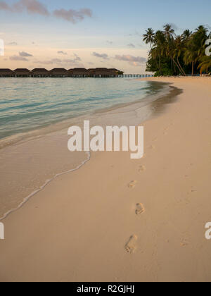 Footprints in the sand on the beach at Meeru Island, Maldives Stock Photo